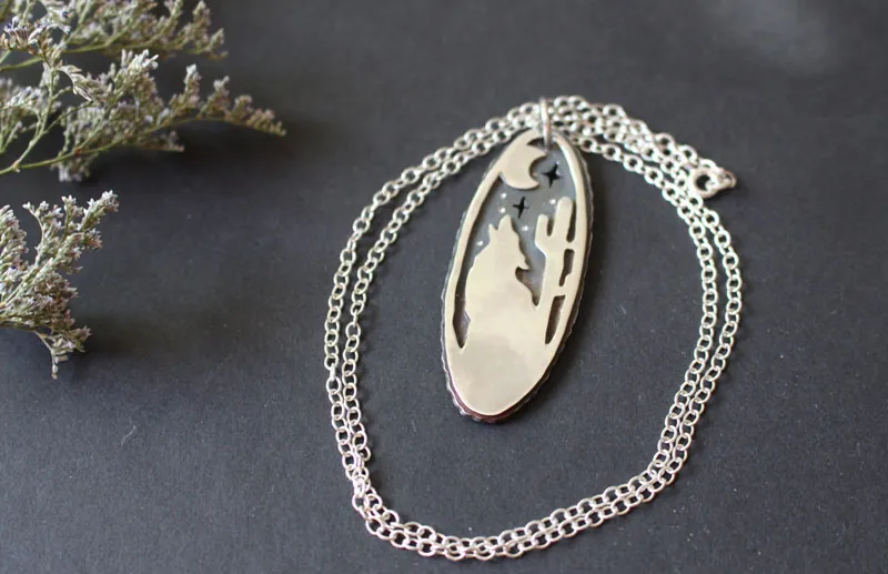 Howling at the moon, desert coyote necklace in sterling silver