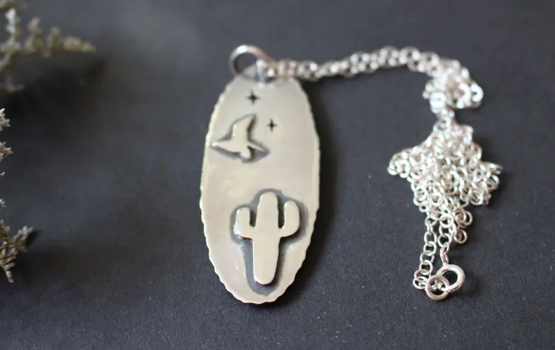Howling at the moon, desert coyote necklace in sterling silver