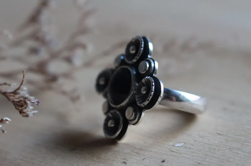 In the shade of the blossoming plum tree, nature ring in silver and amethyst
