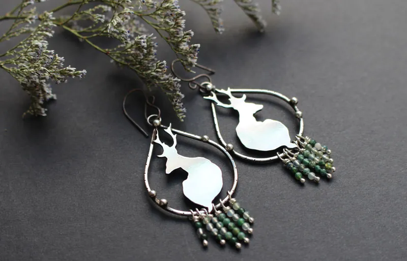In the stillness of dawn, deer earrings in silver and moss agate