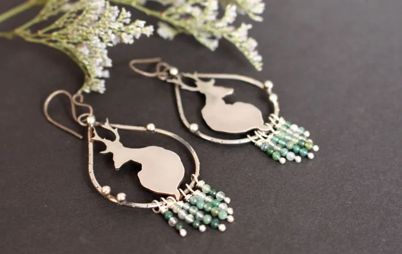 In the stillness of dawn, deer earrings in silver and moss agate