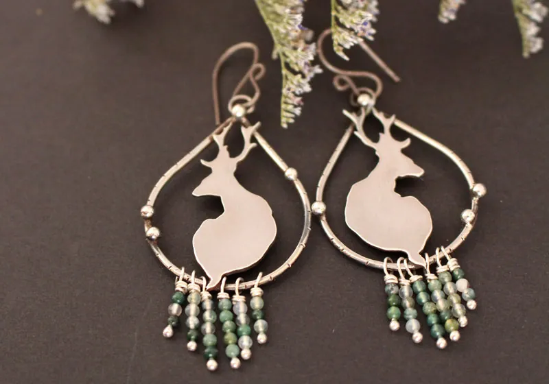 In the stillness of dawn, deer earrings in silver and moss agate