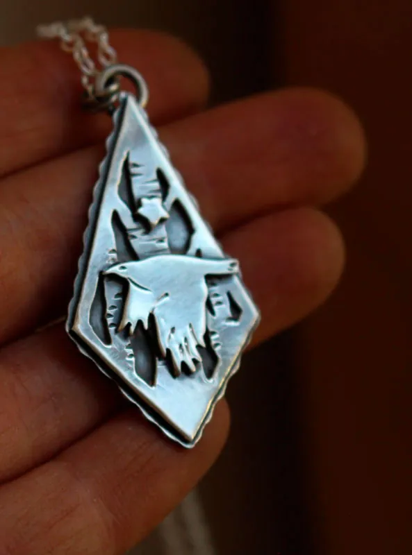 Instinct, raven and star necklace in sterling silver