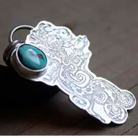 Kukulkan, feathered serpent inspired by the Maya civilization pendant in silver and turquoise