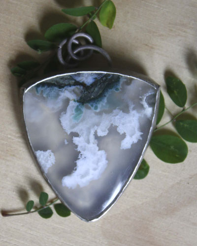Land of ice, ice floe landscape pendant in silver and moss agate