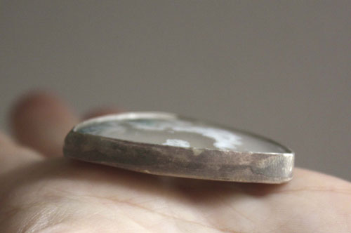 Land of ice, ice floe landscape pendant in silver and moss agate