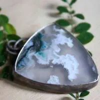 Land of ice, ice floe landscape pendant in silver and moss agate