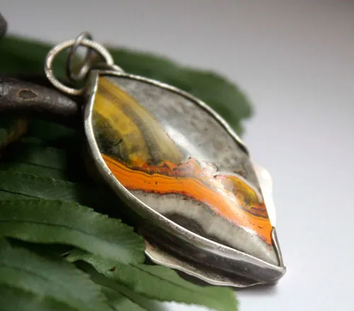 Liekki, Sami fire pendant in silver and bumblebee jasper