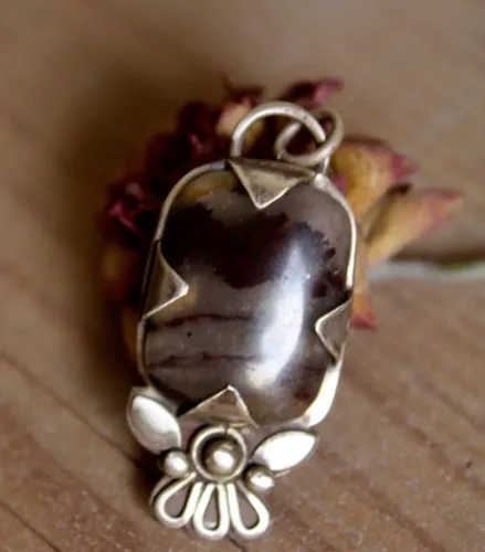 Loha, iron flower pendant in silver and iron jasper