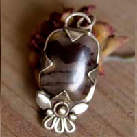 Loha, iron flower pendant in silver and iron jasper