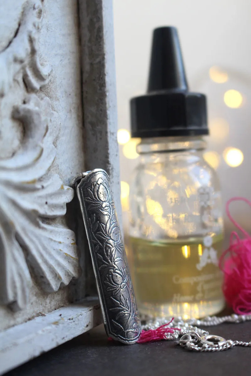 Lotus flower case, tubular botanical and aromatherapy diffuser pendant in silver