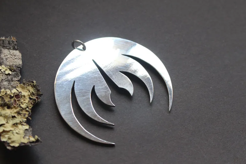 Magma deluxe, rock band logo pendant in sterling silver