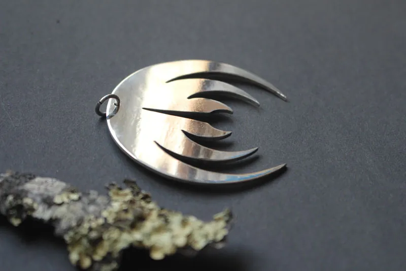 Magma deluxe, rock band logo pendant in sterling silver