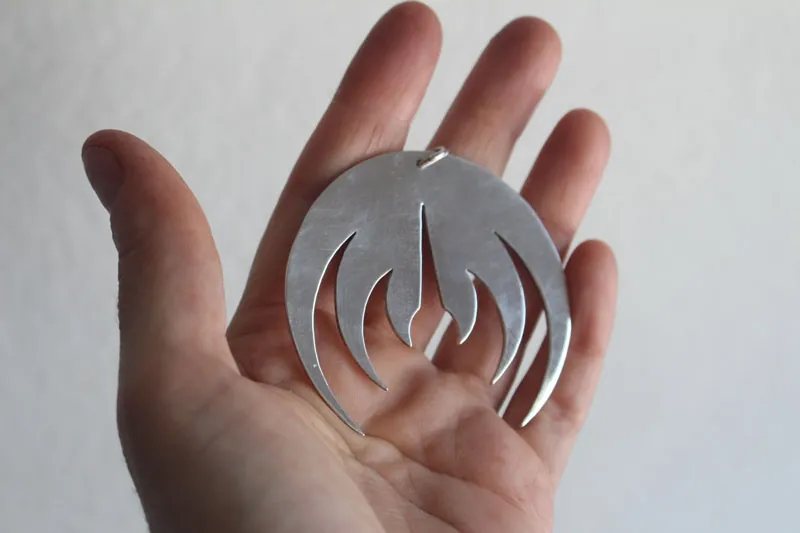 Magma deluxe, rock band logo pendant in sterling silver