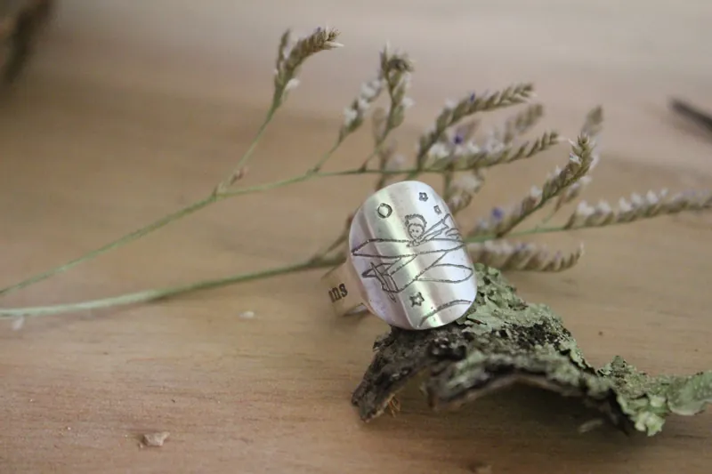 Make your life a dream and a dream a reality, the little prince’s plane ring in silver