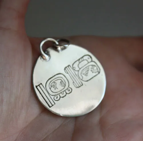 Mesoamerica, Pre-Hispanic Aztec and Maya calendar pendant in silver