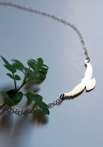 Message, bird symbol necklace in sterling silver