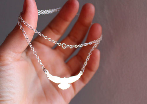 Message, bird symbol necklace in sterling silver