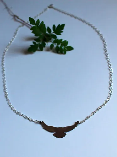 Message, bird symbol necklace in sterling silver