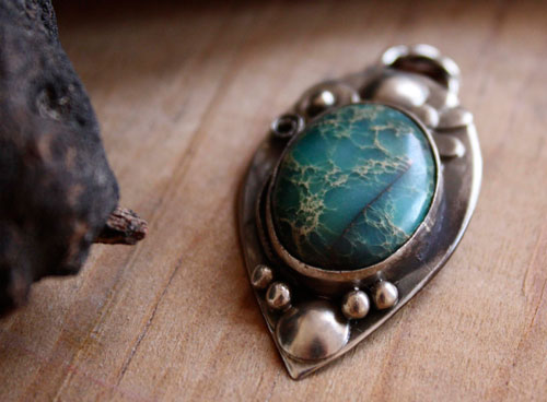 Monsoon, duality of nature pendant in silver and serpentine