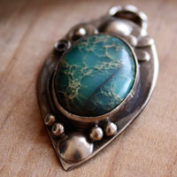 Monsoon, duality of nature pendant in silver and serpentine