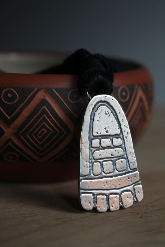 Movement, olmec foot necklace in sterling silver