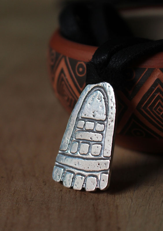 Movement, olmec foot necklace in sterling silver