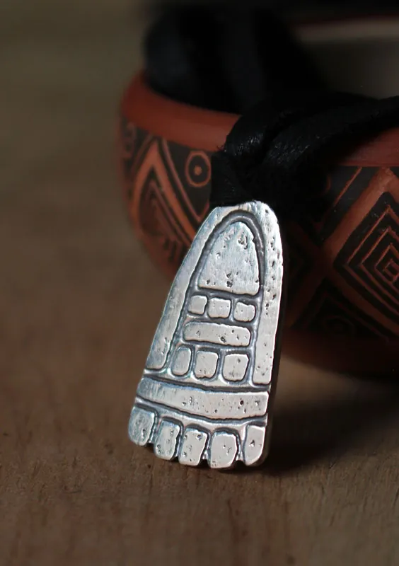 Movement, olmec foot necklace in sterling silver