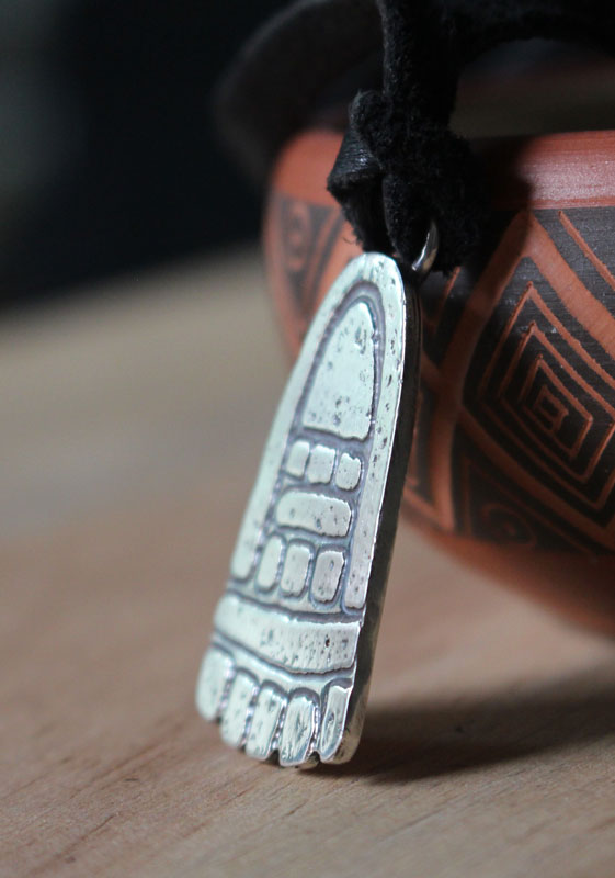 Movement, olmec foot necklace in sterling silver