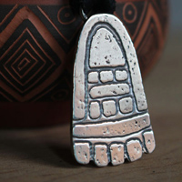 Movement, olmec foot necklace in sterling silver