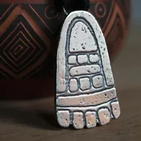 Movement, olmec foot necklace in sterling silver