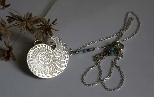 Nautilus, seashell of stability and endurance necklace in silver and turquoise