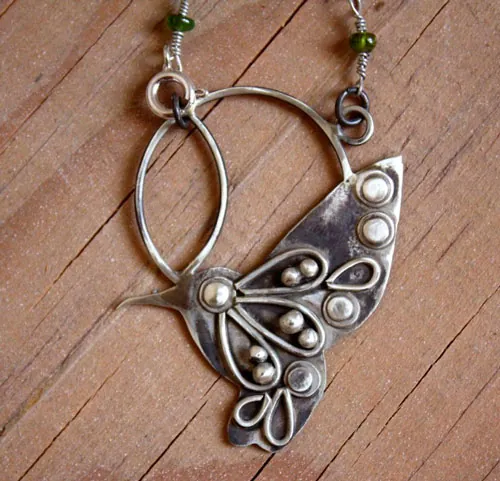 Nectar, hummingbird necklace in silver and green sapphire