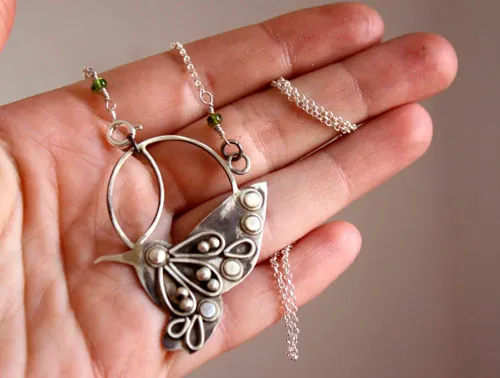 Nectar, hummingbird necklace in silver and green sapphire