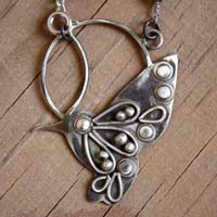 Nectar, hummingbird necklace in silver and green sapphire