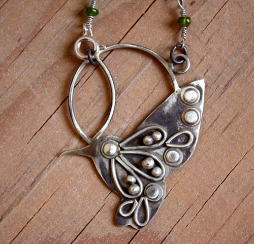 Nectar, hummingbird necklace in silver and green sapphire