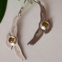 Ode to the sun, Native American eagle earrings in silver and yellow zircon