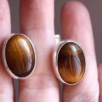 Ojo de León, animal eye cufflinks in sterling silver and Tiger’s Eye