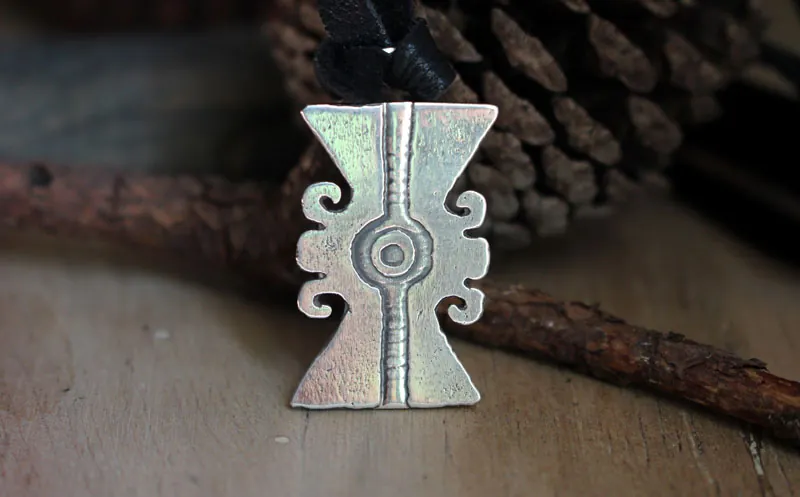 Ollin, Aztec glyph necklace in sterling silver