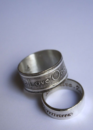 One life, declaration inspired by U2’s One ring in silver