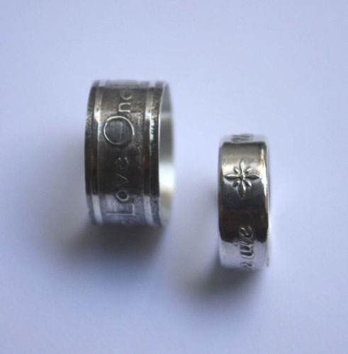 One life, declaration inspired by U2’s One ring in silver
