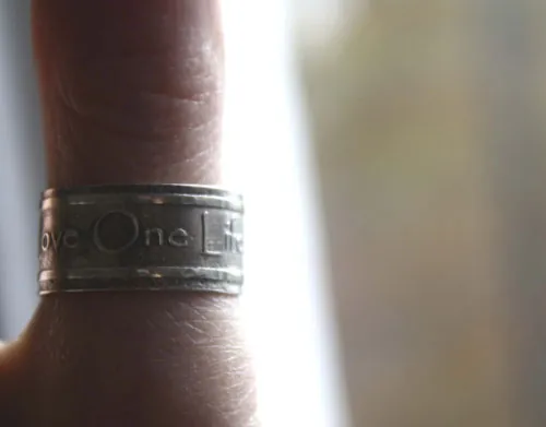 One Love, lyrics from U2’s rock anthem One ring in silver