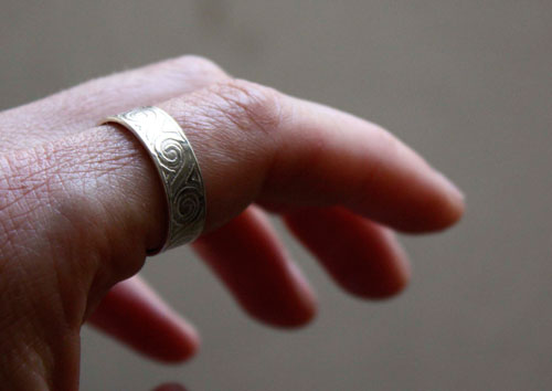 One life, declaration inspired by U2’s One ring in silver