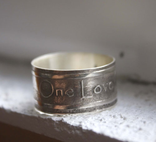 One Love, lyrics from U2’s rock anthem One ring in silver