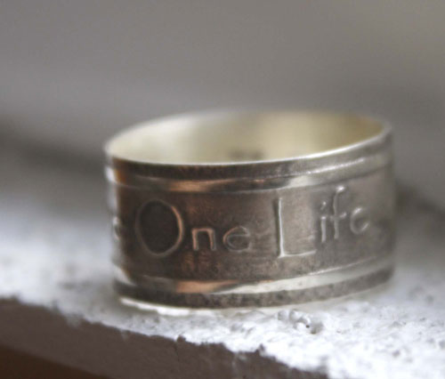 One Love, lyrics from U2’s rock anthem One ring in silver