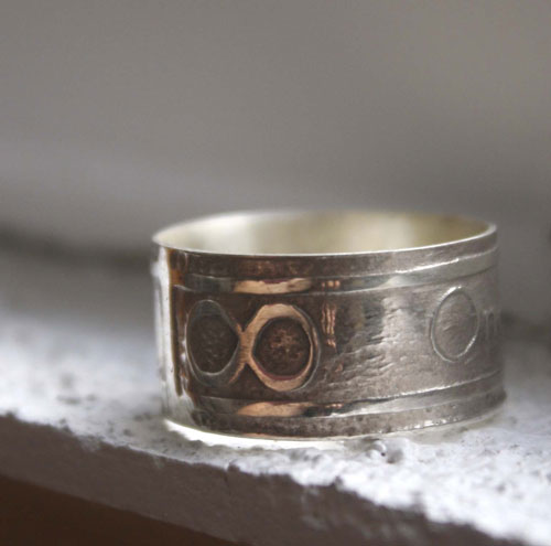 One Love, lyrics from U2’s rock anthem One ring in silver