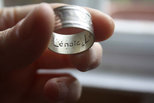 One Love, lyrics from U2’s rock anthem One ring in silver