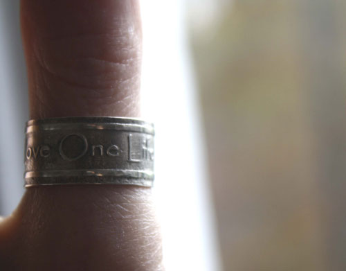 One Love, lyrics from U2’s rock anthem One ring in silver
