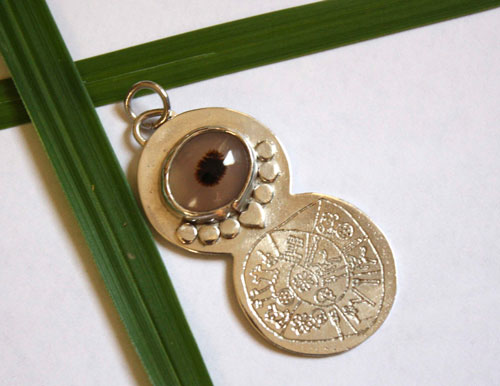 Phaistos, Minoan Phaistos disc pendant in silver and dendritic agate