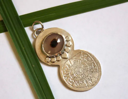 Phaistos, Minoan Phaistos disc pendant in silver and dendritic agate